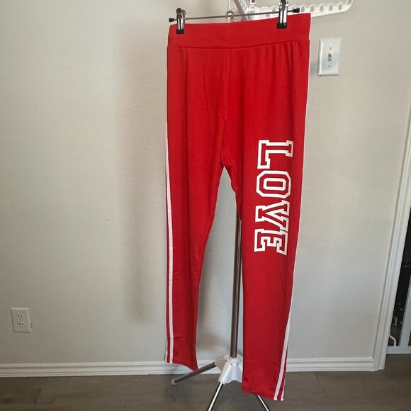 Red joggers with white stripped sides size small / med - Picture 1 of 3